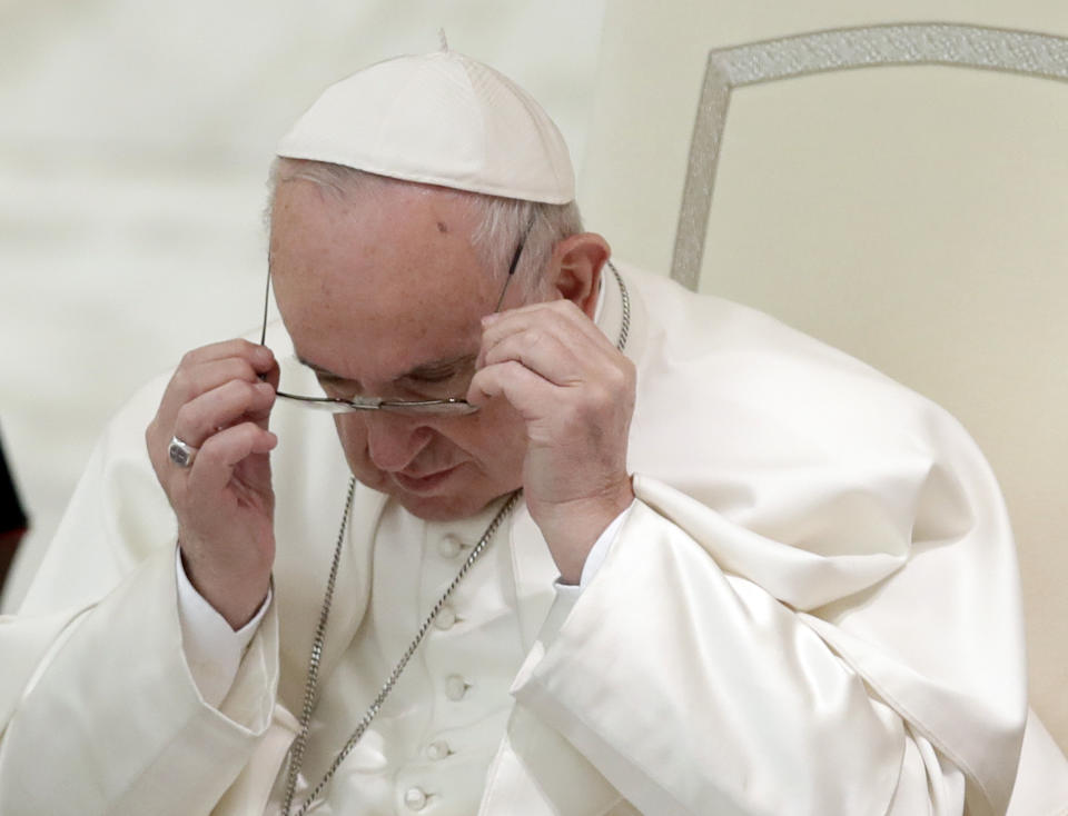 Pope Francis wears his glasses as he arrives in the Paul VI Hall at the Vatican for a audience with students, family and teachers of the Barbarigo catholic school of Padua, Saturday, March 23, 2019. (AP Photo/Alessandra Tarantino)