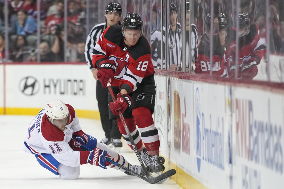 Montreal Canadiens right wing Brendan Gallagher (11) skates against New Jersey Devils left wing Ondrej Palat (18) during the second period of an NHL hockey game, Saturday, Feb. 24, 2024, in Newark, N.J. (AP Photo/Mary Altaffer)