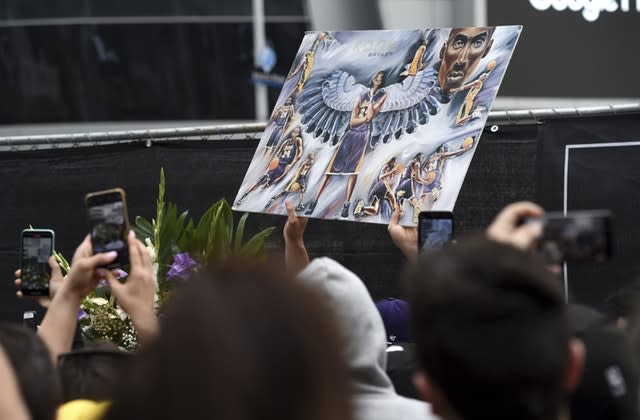 Fans took photos of artwork featuring the former Los Angeles Laker