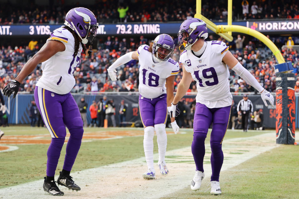 CHICAGO, ILLINOIS - JANUARY 08:  Wide receiver Adam Thielen #19 celebrates a touchdown with wide receiver K.J. Osborn #17 and wide receiver Justin Jefferson #18 of the Minnesota Vikings during the 1st quarter of the game against the Chicago Bears at Soldier Field on January 08, 2023 in Chicago, Illinois. (Photo by Michael Reaves/Getty Images)