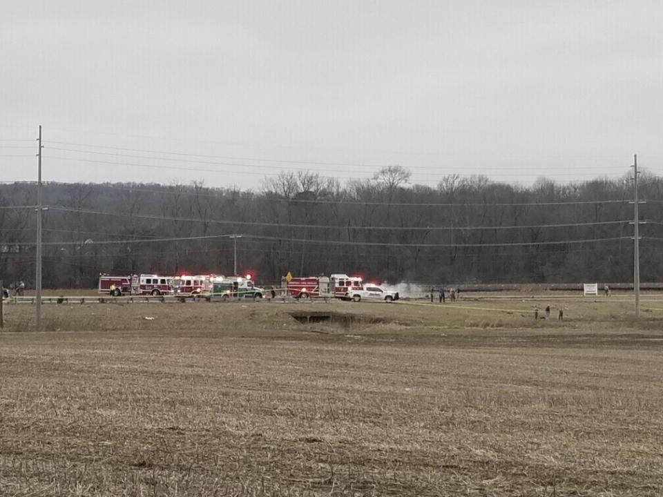 In this image provided by WHNT News 19, police and fire personnel respond to a Black Hawk helicopter crash Wednesday, Feb. 15, 2023, in the unincorporated community of Harvest, Ala. U.S. military officials say two people on board the helicopter, which was from the Tennessee National Guard, were killed. (Chris Frierson/WHNT News 19/Nexstar Media Group via AP)