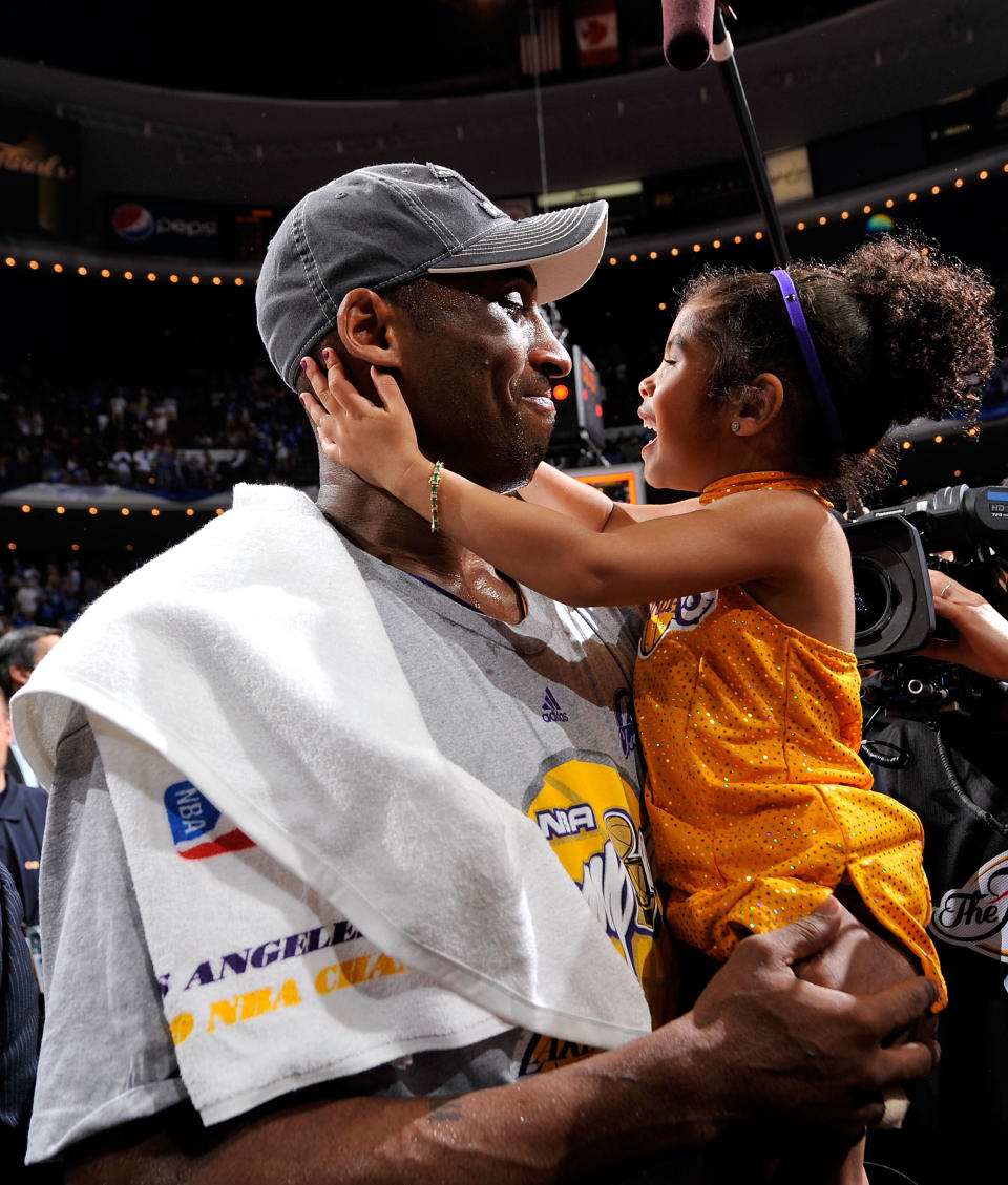 Kobe Bryant celebrates daughter Gianna after the Lakers won 99-86 to win the NBA Championship against the Orlando Magic in Game Five of the 2009 NBA Finals at Amway Arena on June 14, 2009 in Orlando, Florida. (Photo by Jesse D. Garrabrant/NBAE via Getty Images)