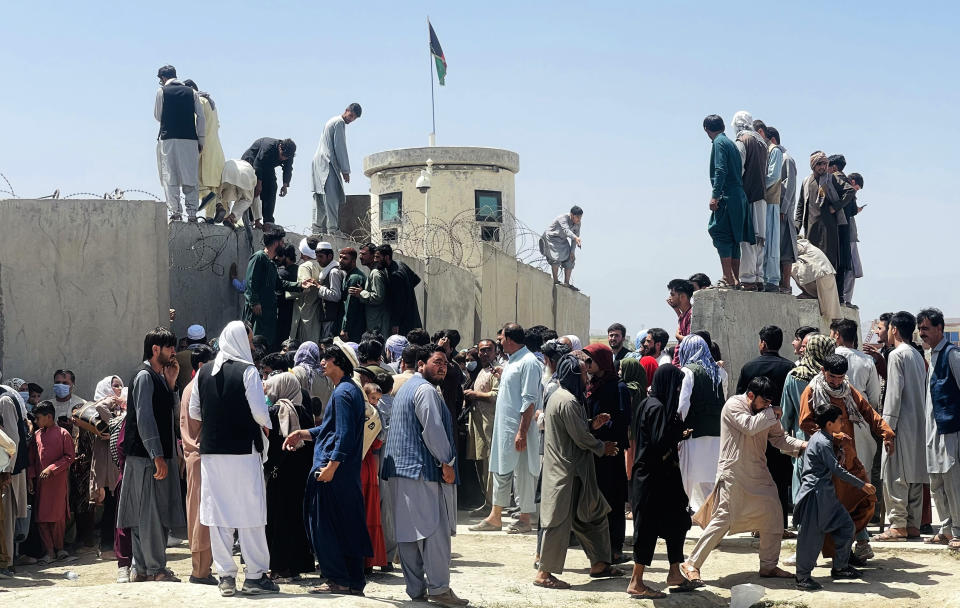 Thousands of Afghans rush to Hamid Karzai International Airport as they try to flee the Afghan capital of Kabul, Afghanistan, on August 16, 2021. (Haroon Sabawoon/Anadolu Agency via Getty Images)