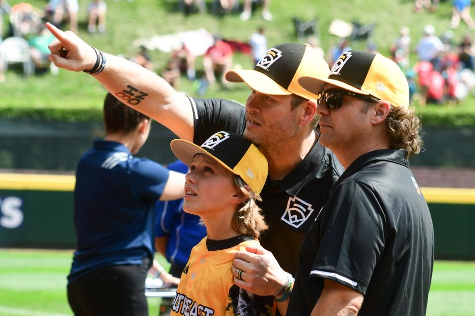 Nolansville Little League manager Mark Carter point out family members in the stands to Nash Carter prior to their game against the Metro Region in the Little League World Series on Friday, Aug 18, 2023 in South Williamsport, Pennsylvania, United States. Mandatory Credit: Ralph Wilson-The Tennessean