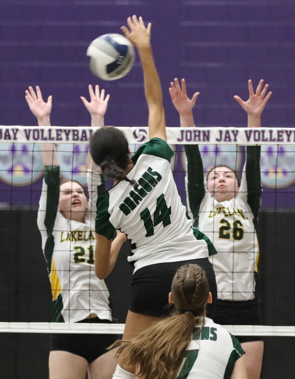 Lakeland's Eve Gallagher and Kayla Jennings defend a shot from Cornwall's Zakara Masibo during the Lakeland vs Cornwall Class A girls volleyball regional final at John Jay High School in Cross River, Nov. 11, 2022.