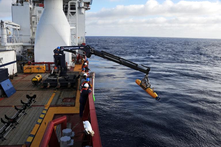 A file photo shows US Navy operators searching for missing Malaysia Airlines flight MH370 in the southern Indian Ocean in April 2014