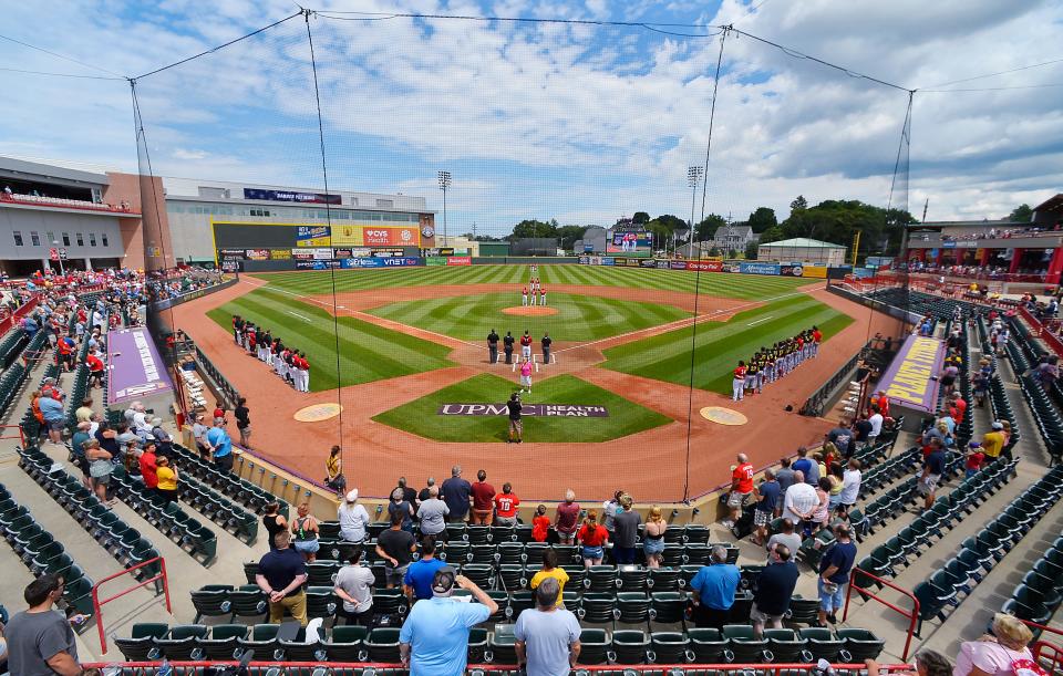 Fans stand for the national anthem as the Erie SeaWolves host the Reading Fightin' Phils at UPMC Park in Erie on July 26, 2022.