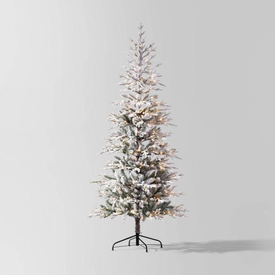 <p><a href="https://www.target.com/p/7-5-39-pre-lit-glitter-flocked-indexed-balsam-fir-artificial-christmas-tree-pure-white-lights-wondershop-8482/-/A-87305078" rel="nofollow noopener" target="_blank" data-ylk="slk:Shop Now;elm:context_link;itc:0;sec:content-canvas" class="link ">Shop Now</a></p><p>7.5' Pre-lit Glitter FlockedBalsam Fir Artificial Christmas Tree</p><p>target.com</p><p>$250.00</p><span class="copyright">Target</span>