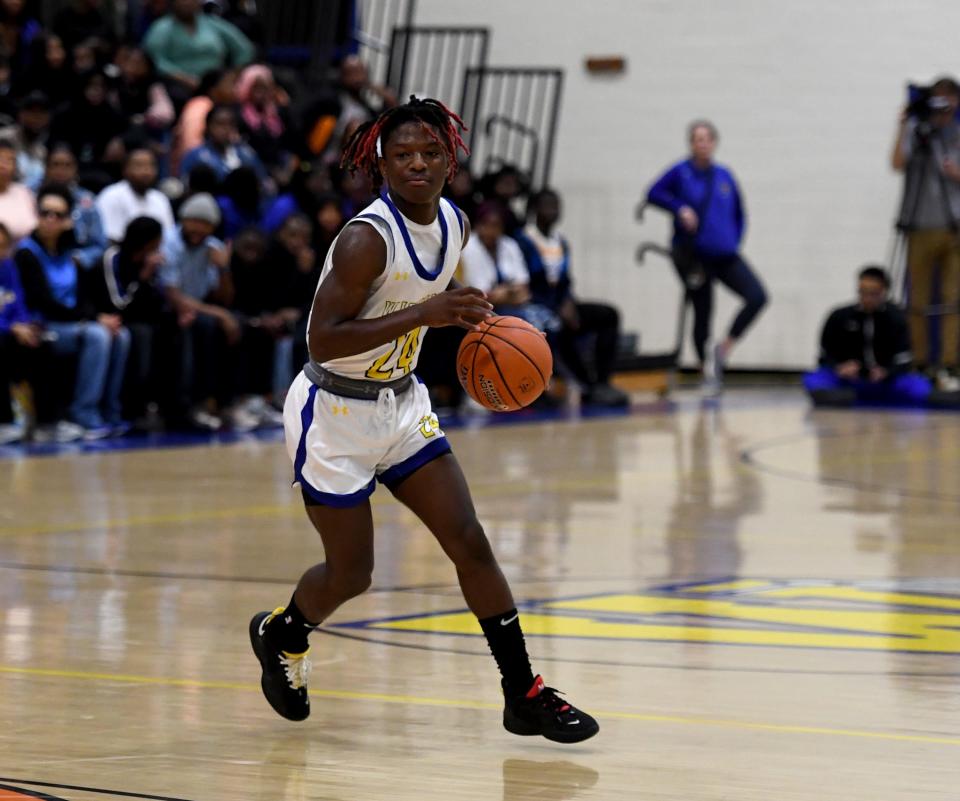 Wi-Hi's Malique Leatherbury (24) dribbles in the game against Bennett Thursday, Feb. 16, 2023, in Salisbury, Maryland. Wi-Hi defeated Bennett 77-74 for the city championship.