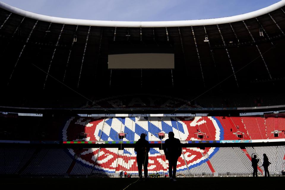 Workers prepare the FC Bayern Munich soccer stadium Allianz Arena in Munich, Germany, Wednesday, Nov. 9, 2022. The Tampa Bay Buccaneers are set to play the Seattle Seahawks in an NFL game at the Allianz Arena in Munich on Sunday. (AP Photo/Matthias Schrader)