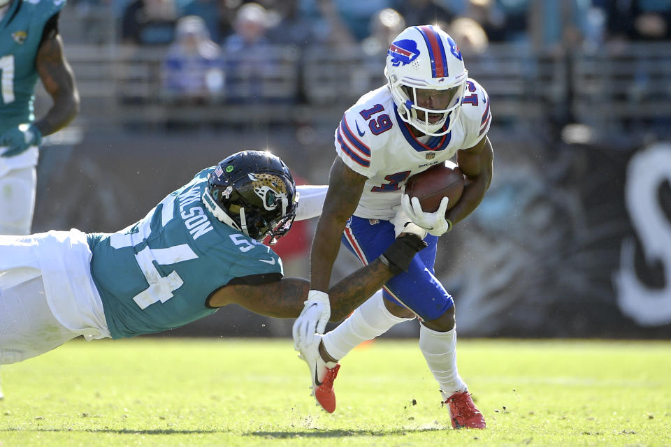 Buffalo Bills wide receiver Isaiah McKenzie (19) tries to evade a tackle by Jacksonville Jaguars linebacker Damien Wilson (54) during the second half of an NFL football game, Sunday, Nov. 7, 2021, in Jacksonville, Fla. (AP Photo/Phelan M. Ebenhack)