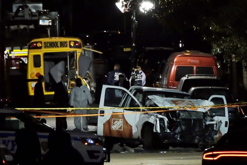 NYPD officers collect evidence around a Home Depot truck used to strike pedestrians leaving eight dead in Lower Manhattan on October 31, 2017. File Photo by John Angelillo/UPI