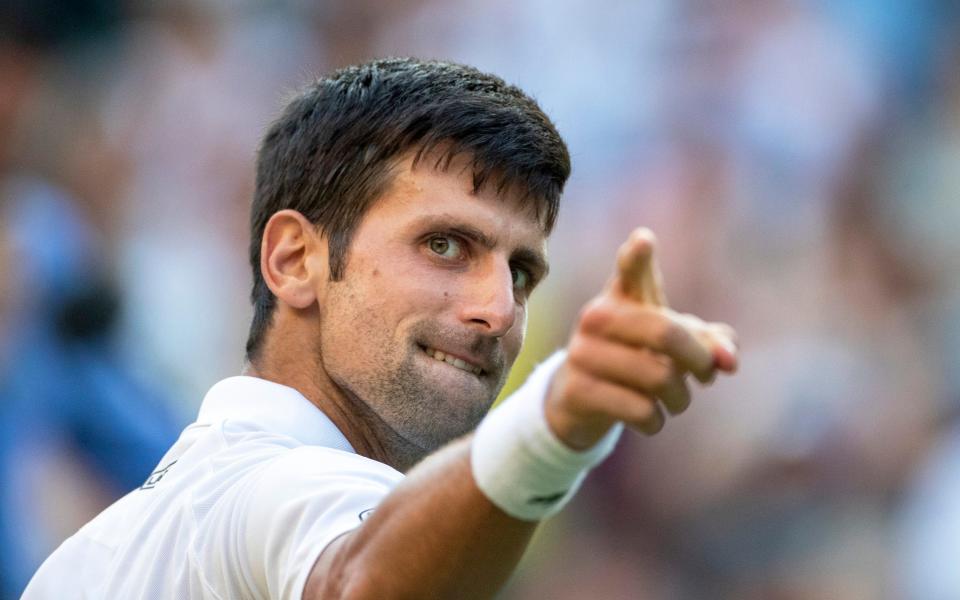 Djokovic celebrates his victory against Kyle Edmund at Wimbledon in 2018 - Getty