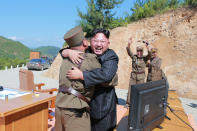 <p>North Korean leader Kim Jong Un reacts with scientists and technicians of the DPRK Academy of Defence Science after the test launch of the intercontinental ballistic missile Hwasong-14 in this undated photo released by North Korea’s Korean Central News Agency (KCNA) in Pyongyang July, 5, 2017. (Photo: KCNA/via Reuters) </p>