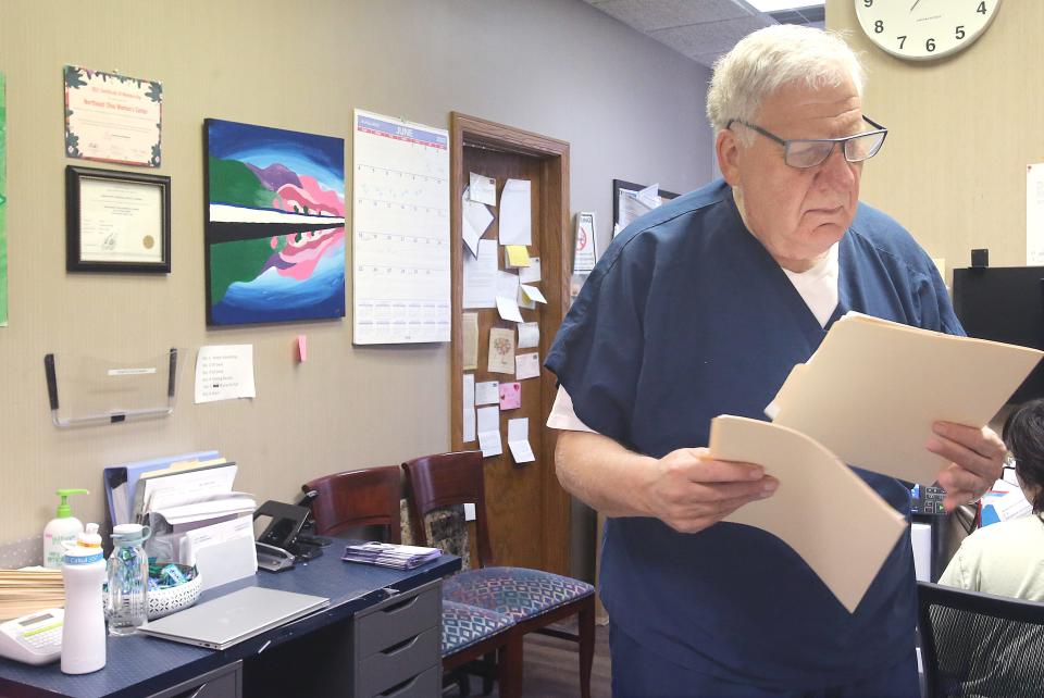 Northeast Ohio Women's Center Dr. David Burkons checks patient files on Thursday, June 1, 2023 in Cuyahoga Falls.