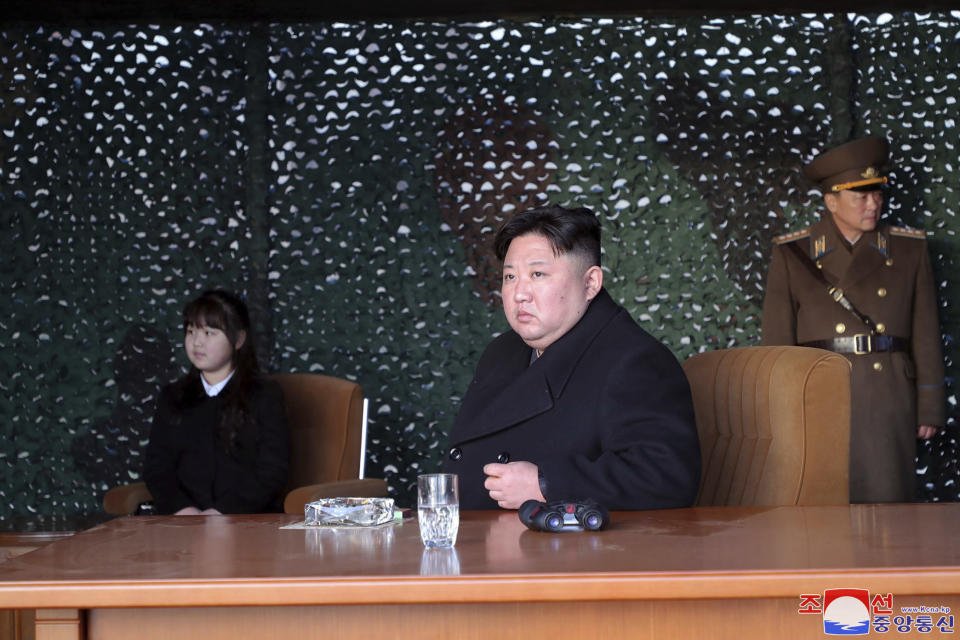 In this photo provided by the North Korean government, North Korean leader Kim Jong Un, with his daughter, inspects what it says is an artillery drill at an undisclosed location in North Korea, Thursday, March 9, 2023. Independent journalists were not given access to cover the event depicted in this image distributed by the North Korean government. The content of this image is as provided and cannot be independently verified. Korean language watermark on image as provided by source reads: "KCNA" which is the abbreviation for Korean Central News Agency. (Korean Central News Agency/Korea News Service via AP)