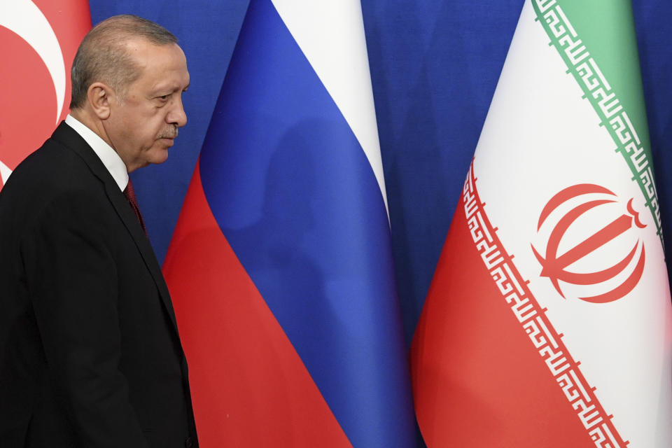 Turkey's President Recep Tayyip Erdogan arrives to attend a news conference following the Russia-Iran-Turkey summit in Iran on Friday Sept. 7, 2018. Putin, Erdogan and Iran's President Hassan Rouhani began a meeting Friday in Tehran to discuss the war in Syria, with all eyes on a possible military offensive to retake the last rebel-held bastion of Idlib. (Kirill Kudryavtsev/Pool Photo via AP)