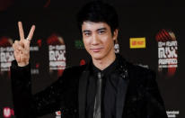 Taiwanese singer Wang Lee Hom twists it on the red carpet