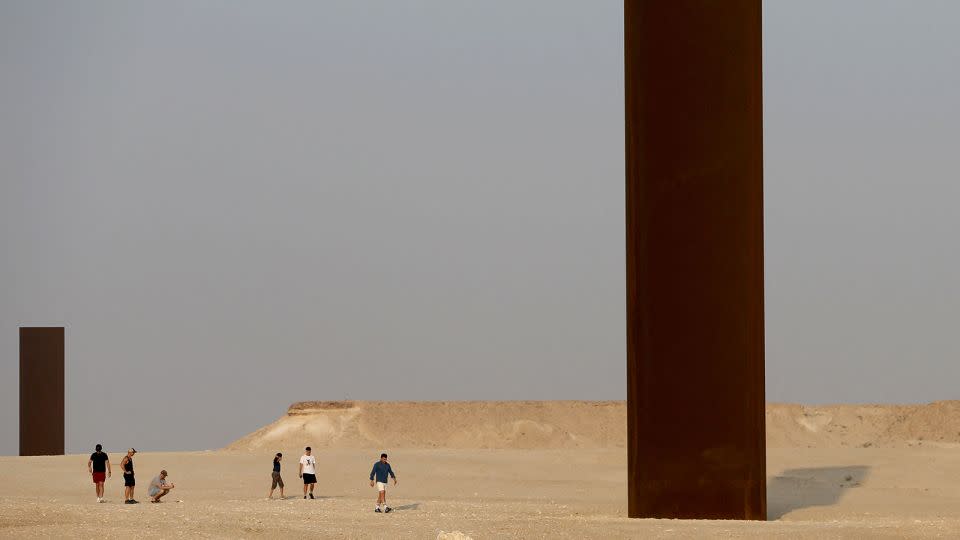 Two of the four steel slabs that Serra erected in Qatar as part of the 2014 installation "East-West/West-East." - Mustafa Abumunes/AFP/Getty Images