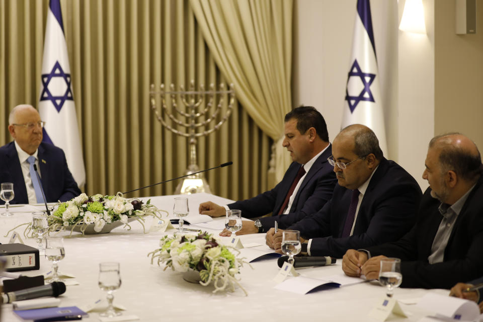 Israeli President Reuven Rivlin, left, listens to members of the Joint List Ayman Odeh, third right, Ahmad Tibi, second right, and Mansour Abbas, during a consultation meeting with in Jerusalem, Sunday, Sept. 22, 2019. Rivlin began two days of crucial talks Sunday with party leaders before selecting his candidate for prime minister, after a deadlocked repeat election was set to make forming any new government a daunting task. (Menahem Kahana/Pool via AP)