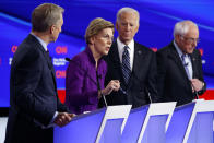 Democratic presidential candidate Sen. Elizabeth Warren, D-Mass., second from left, speaks as fellow candidates businessman Tom Steyer, left, former Vice President Joe Biden and Sen. Bernie Sanders, I-Vt., right, listen, Tuesday, Jan. 14, 2020, during a Democratic presidential primary debate hosted by CNN and the Des Moines Register in Des Moines, Iowa. (AP Photo/Patrick Semansky)