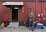 Joe Smith leans against a ladder at the back of his home in Columbus, Ohio, Tuesday, Oct. 24, 2023, where he lives with his granddaughter Olivia. Smith did not picture raising Olivia, but when his daughter's substance use disorder meant she couldn't care for her child, that's where Smith and his wife found themselves nineteen years ago. (AP Photo/Carolyn Kaster)