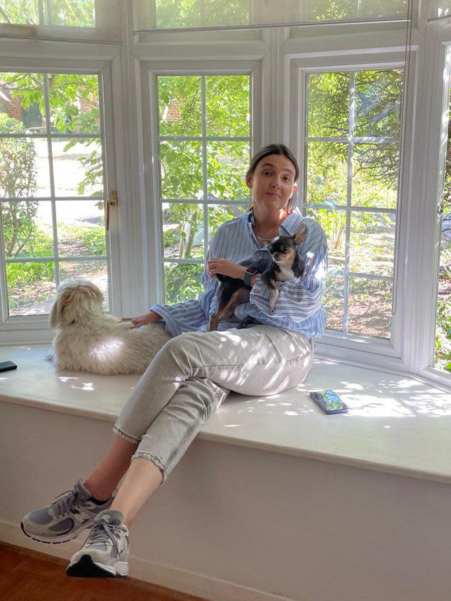 Woman sitting with pets 