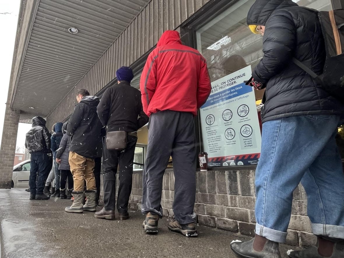 Long lines outside SAAQ offices have become a common sight in parts of Quebec and are causing delays for people hoping to renew their licences and registrations.  (Hadi Hassin/Radio-Canada - image credit)