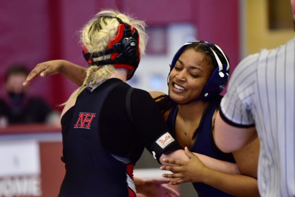 Olivia Palmer of Timber Creek hugs Amanda Connors of Northern Highlands Regional as she wins in the 132 lbs of their semi-final during the Girls Wrestling State Championships at Phillipsburg High School, on Sunday, February 20, 2022.