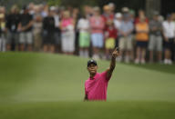 <p>Tiger Woods points to his shot on the eighth fairway during a practice round for the Masters golf tournament Tuesday, April 7, 2015, in Augusta, Ga. (AP Photo/Matt Slocum) </p>