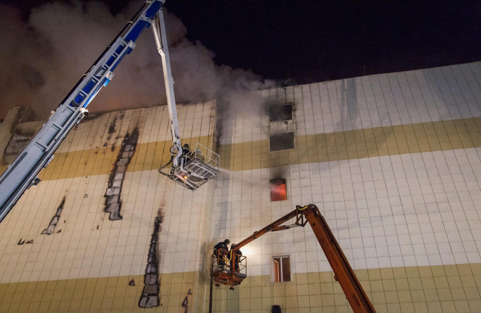 <p>Members of the Emergency Situations Ministry work to extinguish a fire in a shopping mall in the Siberian city of Kemerovo on March 26, 2018. (Photo: Marina Lisova/Reuters) </p>