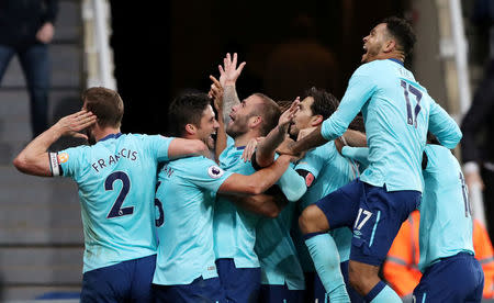 Soccer Football - Premier League - Newcastle United vs AFC Bournemouth - St James' Park, Newcastle, Britain - November 4, 2017 Bournemouth's Steve Cook celebrates scoring their first goal with team mates. REUTERS/Scott Heppell