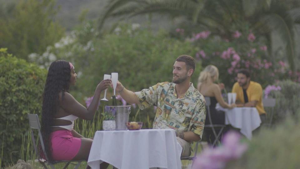 whitney and zach toast during their garden date on love island season 10