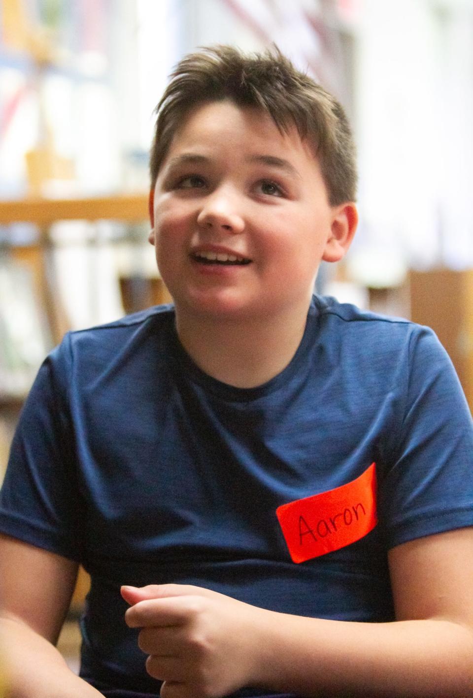 Whitmore Lake Elementary fifth grader Aaron Ray talks about getting to meet the author of 'Everywhere, Wonder' after an assembly by the author and his illustrator wife Robbi Behr Tuesday, Oct. 4, 2022.