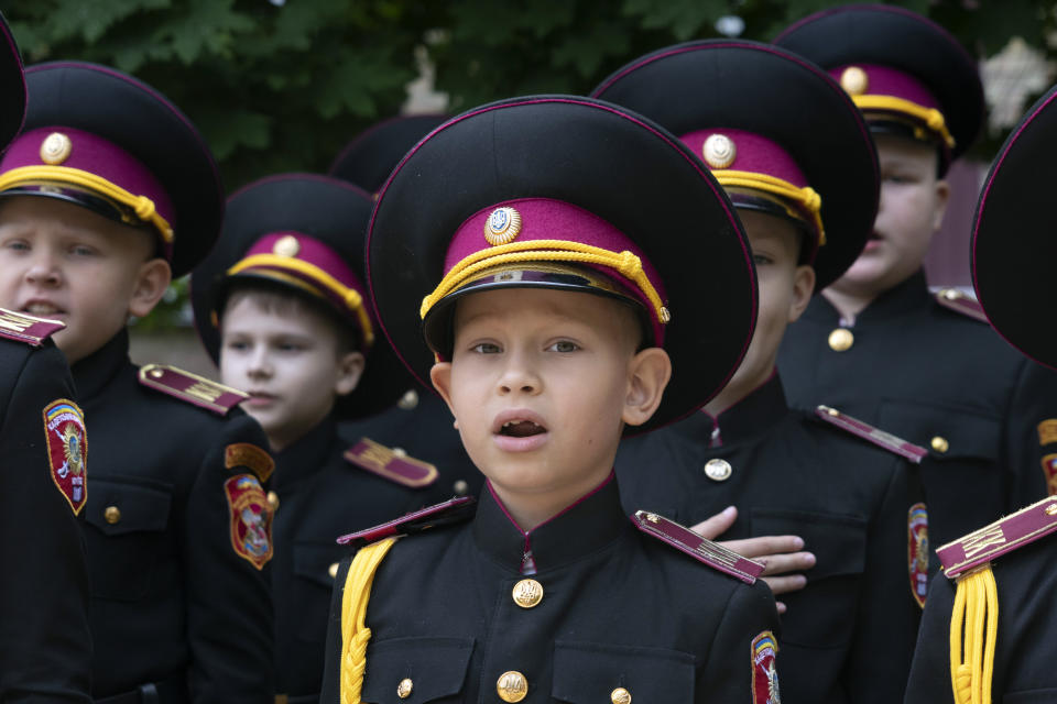 Young cadets sing the national anthem during rehearsal of a ceremony on the first day of school at a cadet lyceum in Kyiv, Ukraine, Thursday, Sept. 1, 2022. (AP Photo/Efrem Lukatsky)