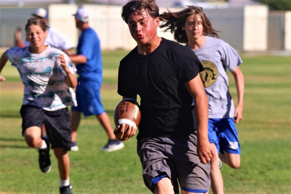 Lucerne Valley players run drills during a recent summer football practice at the school. Lucerne Valley begins the season with a home game against Entrepreneur on Aug. 24.