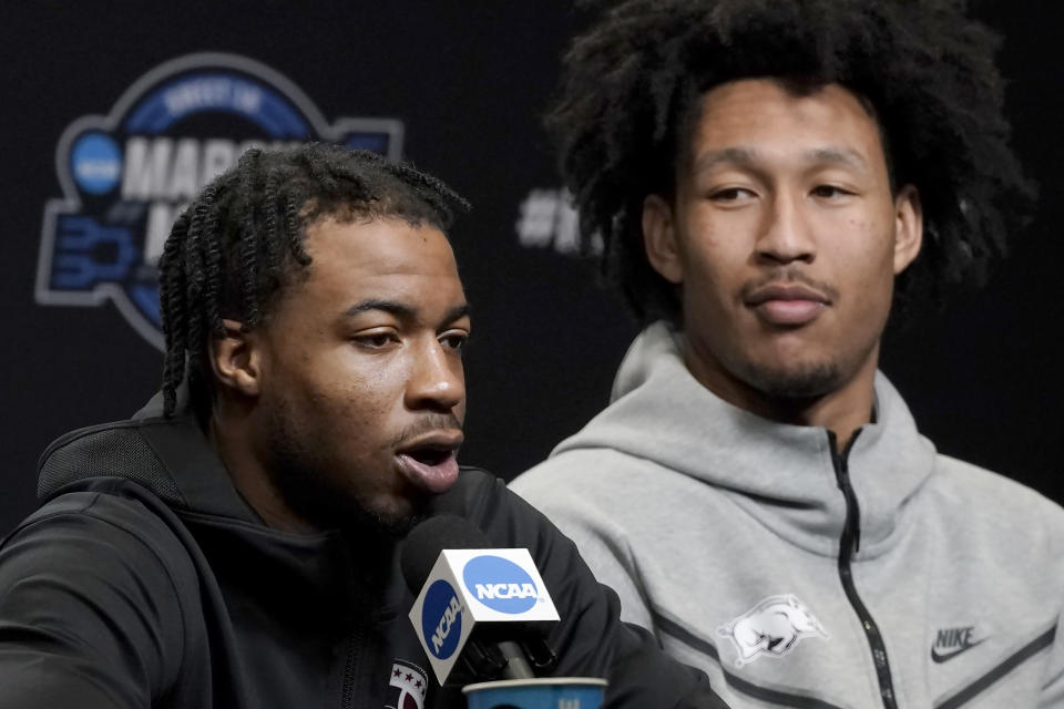 Arkansas guard Stanley Umude, left, and forward Jaylin Williams speak at a news conference for the NCAA men's college basketball tournament in San Francisco, Friday, March 25, 2022. Arkansas faces Duke in an Elite 8 game on Saturday. (AP Photo/Jeff Chiu)