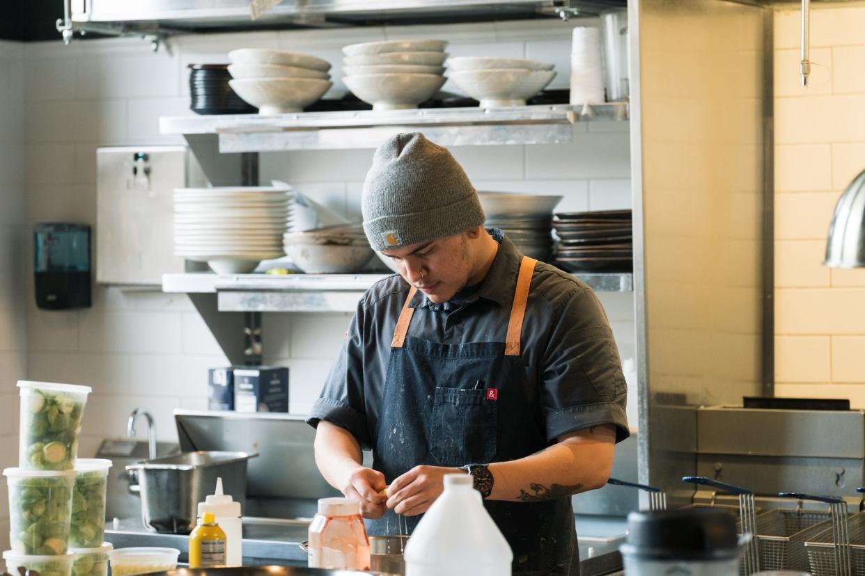 Emanuel Araiza preps for dinner at Roselily in South Bend, the most recent area restaurant to achieve AAA Four Diamond status.