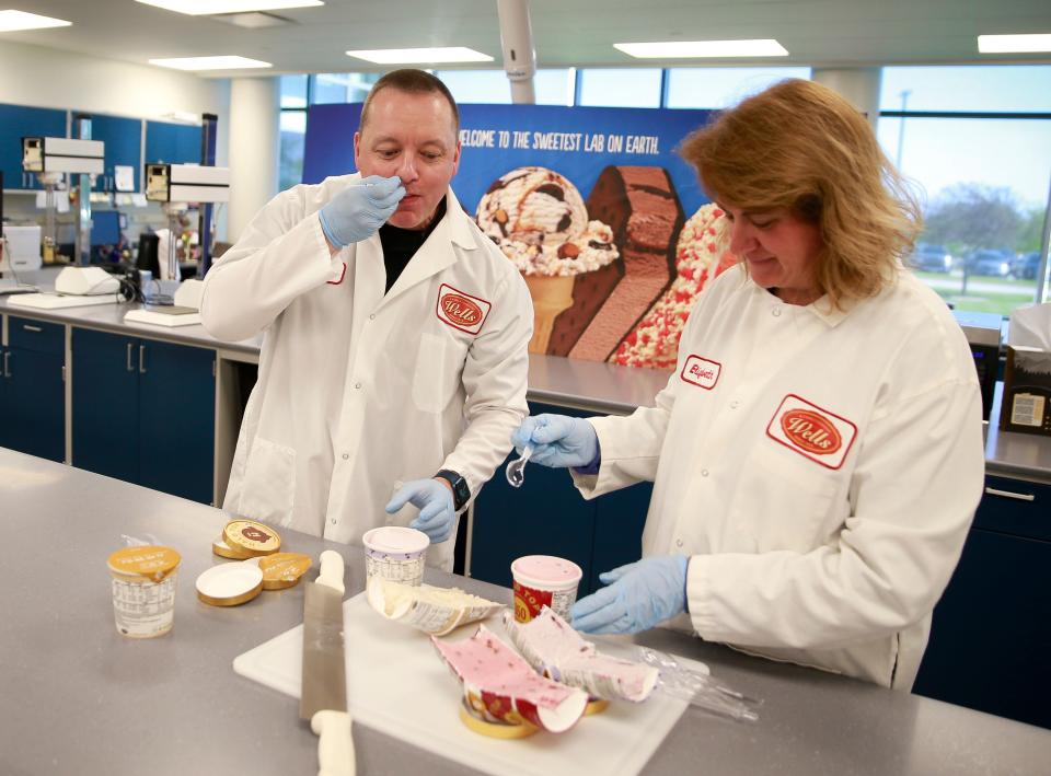 Elizabeth Brennan, right, senior product development technologist, and Jon Oldroyd, senior director of research and development at Wells Enterprises in Le Mars, sample different flavors of Halo Top ice cream in the company's tasting lab.