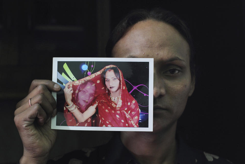 Seema, 33, displays a picture in which she's dressed as a woman at her residence in New Delhi, India, on May 16, 2012. Seema is transgender, one of hundreds of thousands in conservative India who are ostracized, often abused and forced into prostitution.