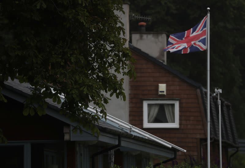 A Union flag flies outside a house on the banks of Gare Loch near Faslane, Scotland