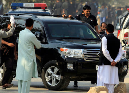 Muhammad Safdar, husband of Maryam Nawaz, daughter of ousted Pakistani premier Nawaz Sharif, waves from a a vehicle as he arrives at an accountability court in Islamabad, Pakistan October 19, 2017. REUTERS/Faisal Mahmood