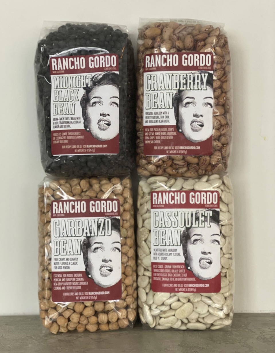 A variety of California-based Rancho Gordo’s heirloom beans are displayed in New York. The beans are creamier and more flavorful than most of the dried beans you can get in a supermarket. (Katie Workman via AP)
