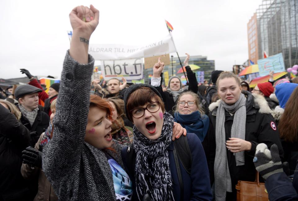 Supporters of the same-sex marriage celebrate outside the Finnish Parliament in Helsinki, Finland on November 28, 2014 after the Finnish parliament approved a bill allowing same sex marriage. AFP PHOTO /Lehtikuva/ VESA MOILANEN *** FINLAND OUT ***        (Photo credit should read VESA MOILANEN/AFP/Getty Images)