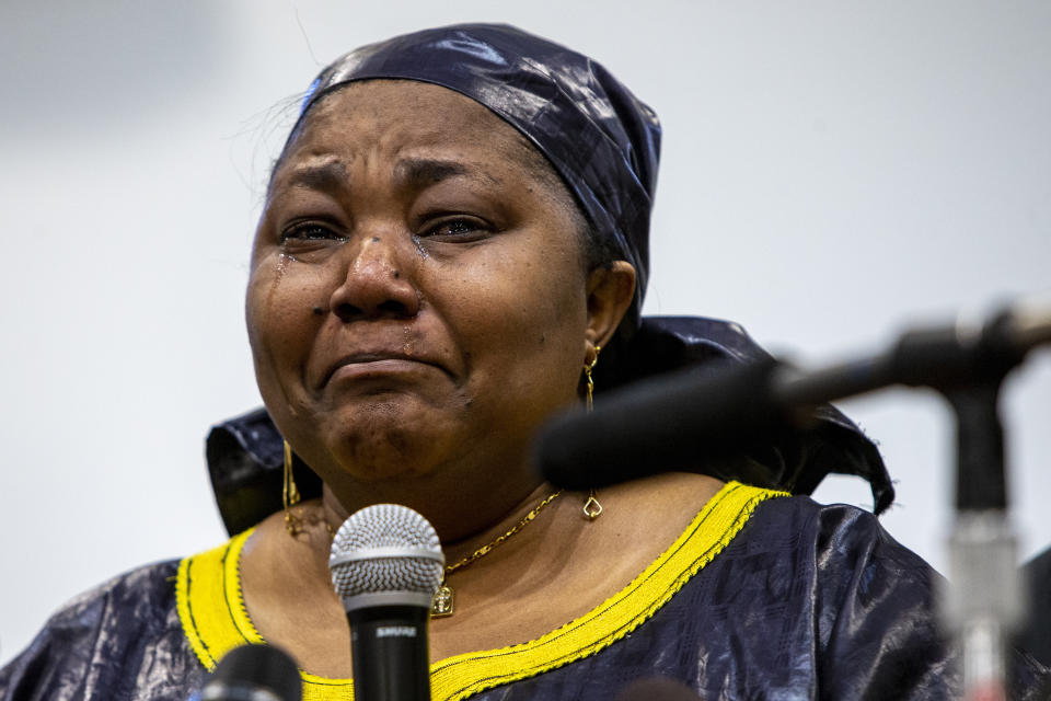 Patrick Lyoya's mother Dorcas Lyoya sheds tears during a news conference at the Renaissance Church of God in Christ Family Life Center in Grand Rapids, Mich. on Thursday, April 14, 2022. Civil rights attorney Ben Crump is representing the family of Patrick Lyoya, who was shot and killed by a GRPD officer on April 4. (Cory Morse/The Grand Rapids Press via AP)