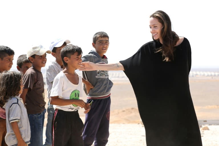 UNHCR special envoy Angelina Jolie talks to children at a Syrian refugee camp in Azraq in northern Jordan