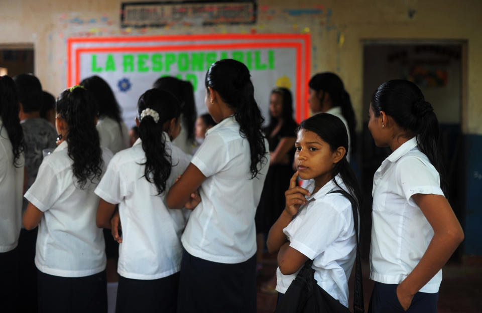 Silvia Alvarado (second from right), 10, lines up before class at the Bernd Grabs School in El Salvador on July 1, 2013.