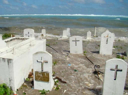 A cemetery in Majuro Atoll is flooded during high tide in the low-lying Marshall Islands, a Pacific atoll chain that sits barely a metre above sea level