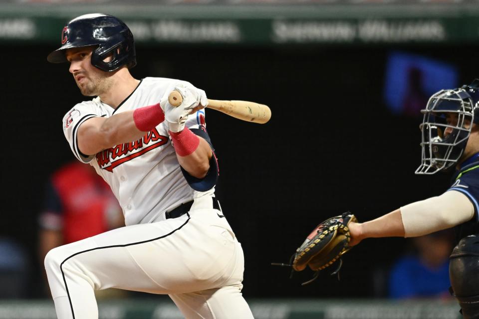 Cleveland Guardians' Lane Thomas (8) hits a double against the Tampa Bay Rays on Sept. 14 in Cleveland.