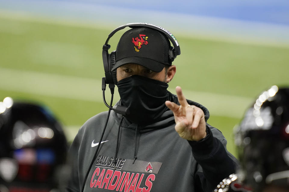 Ball State head coach Mike Neu talks to his team during the first half of the Mid-American Conference championship NCAA college football game against Buffalo, Friday, Dec. 18, 2020, in Detroit. (AP Photo/Carlos Osorio)